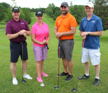 four-player golf team with clubs
